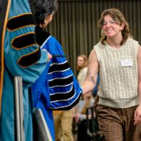 walking across stage